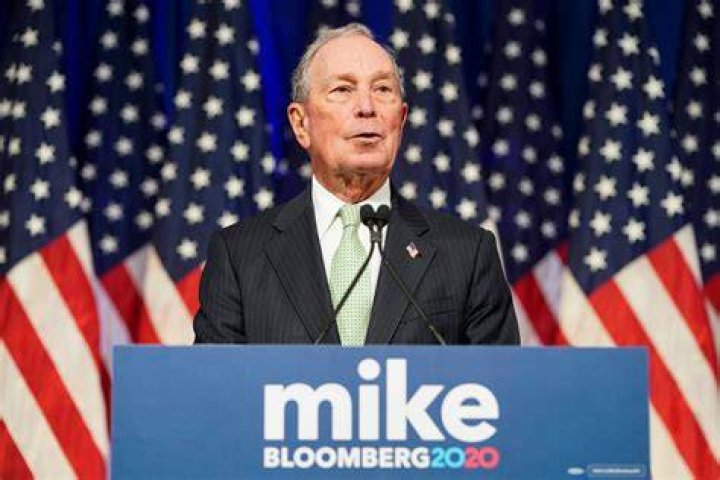 Michael Bloomberg speaking at a conference meeting.