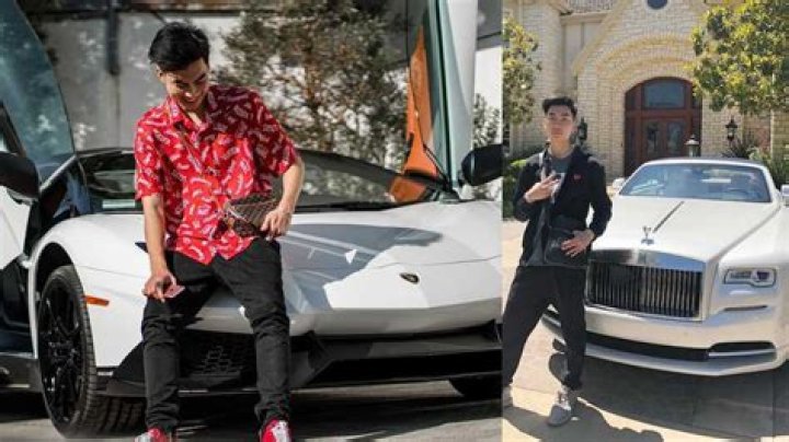 RiceGum posing with his Rolls Royce