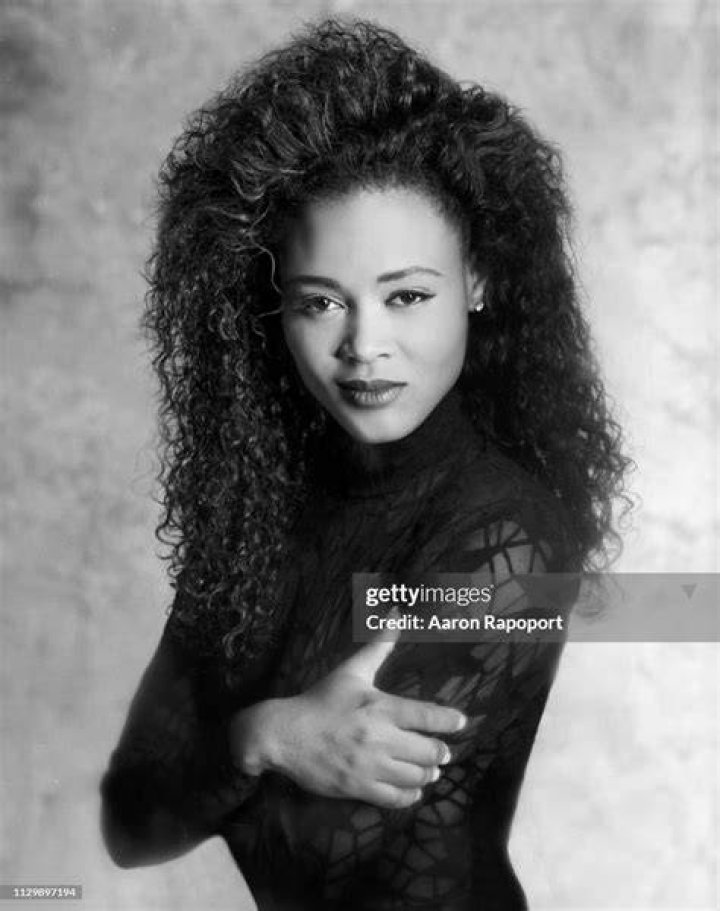 Robin Givens posing in a black shirt.